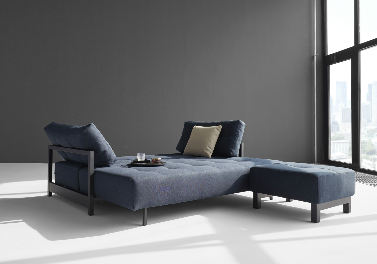 blue sofa bed and foot stool set