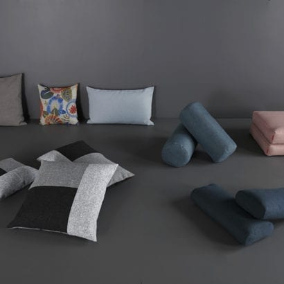 a pile of danish designed cushions