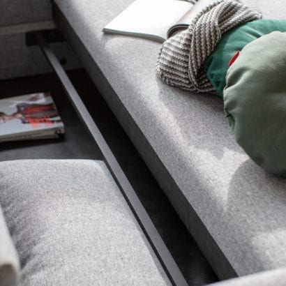 grey sofa with bottom compartment