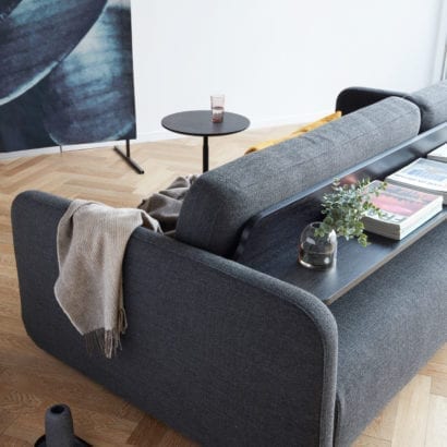 grey sofa with back shelf